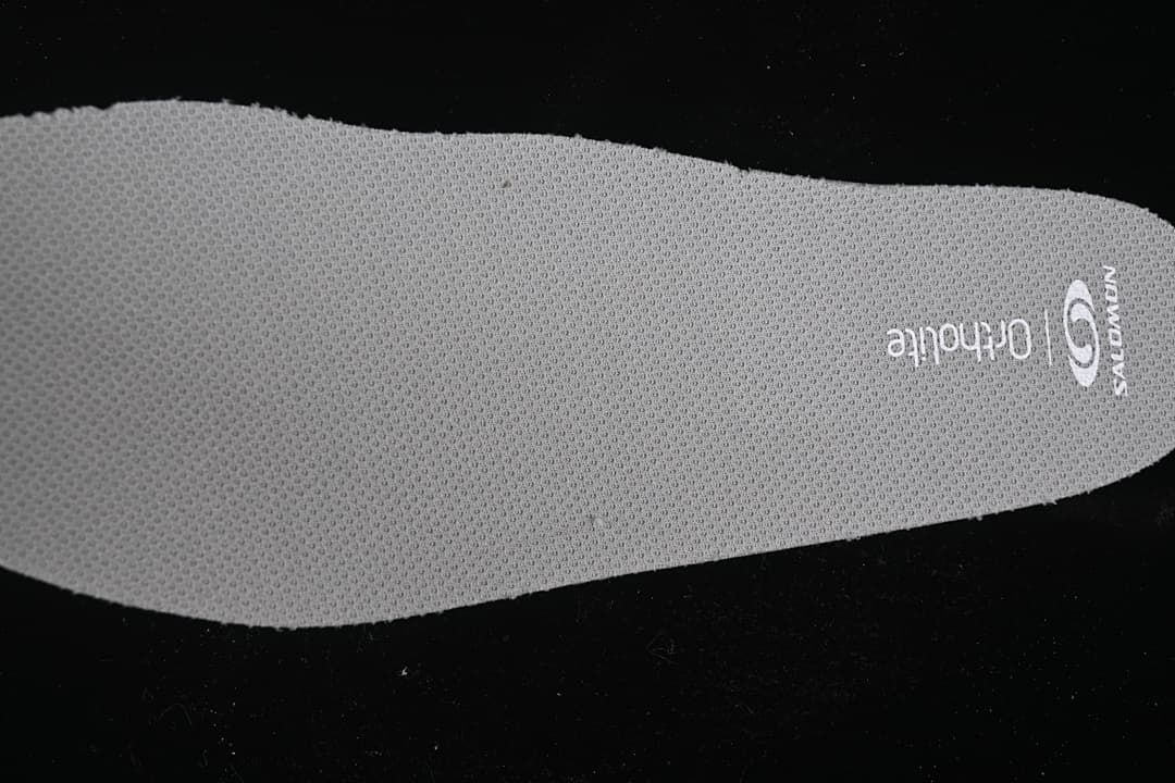 Close-up of the grey insole with Salomon and Ortholite markings