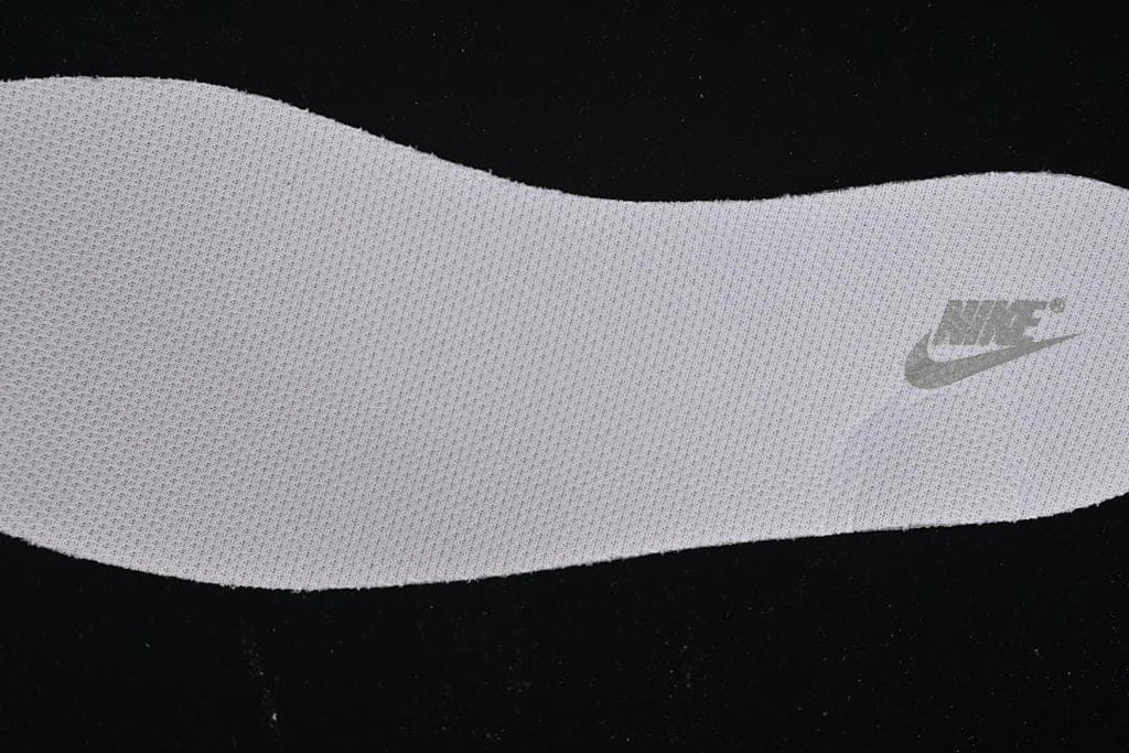 Close-up of the textured shoe insert with a Nike mark
