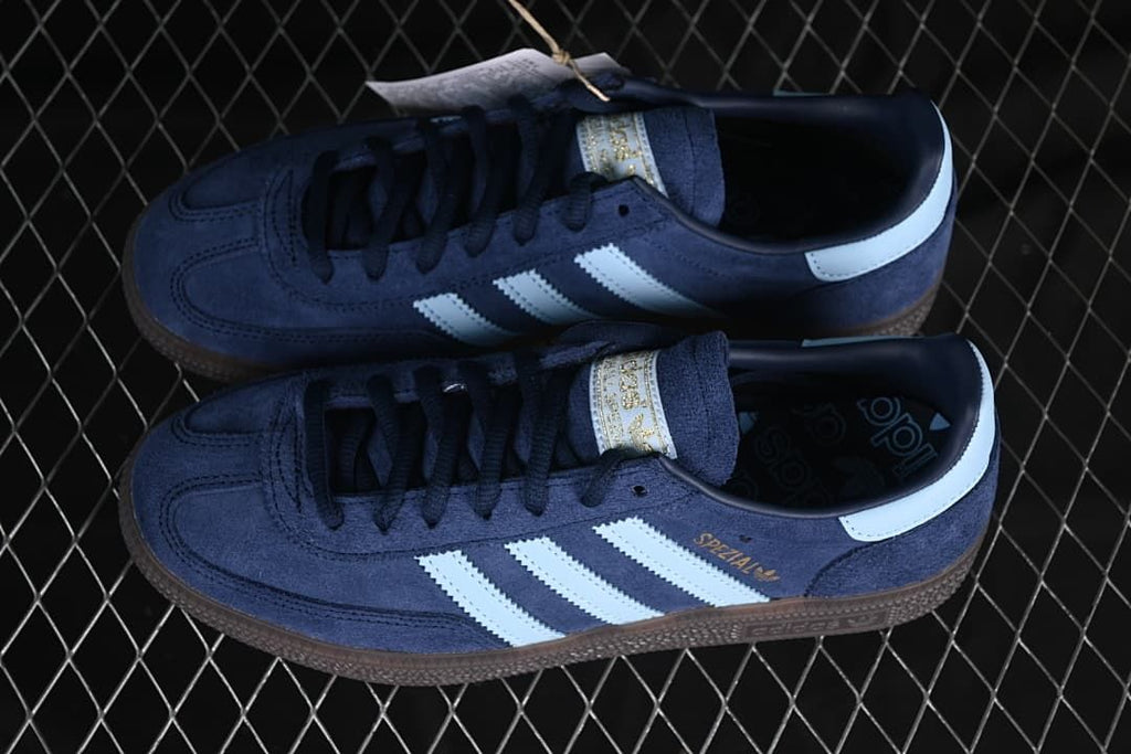 Pair of navy Handball Spezial sneakers with pale blue stripes
