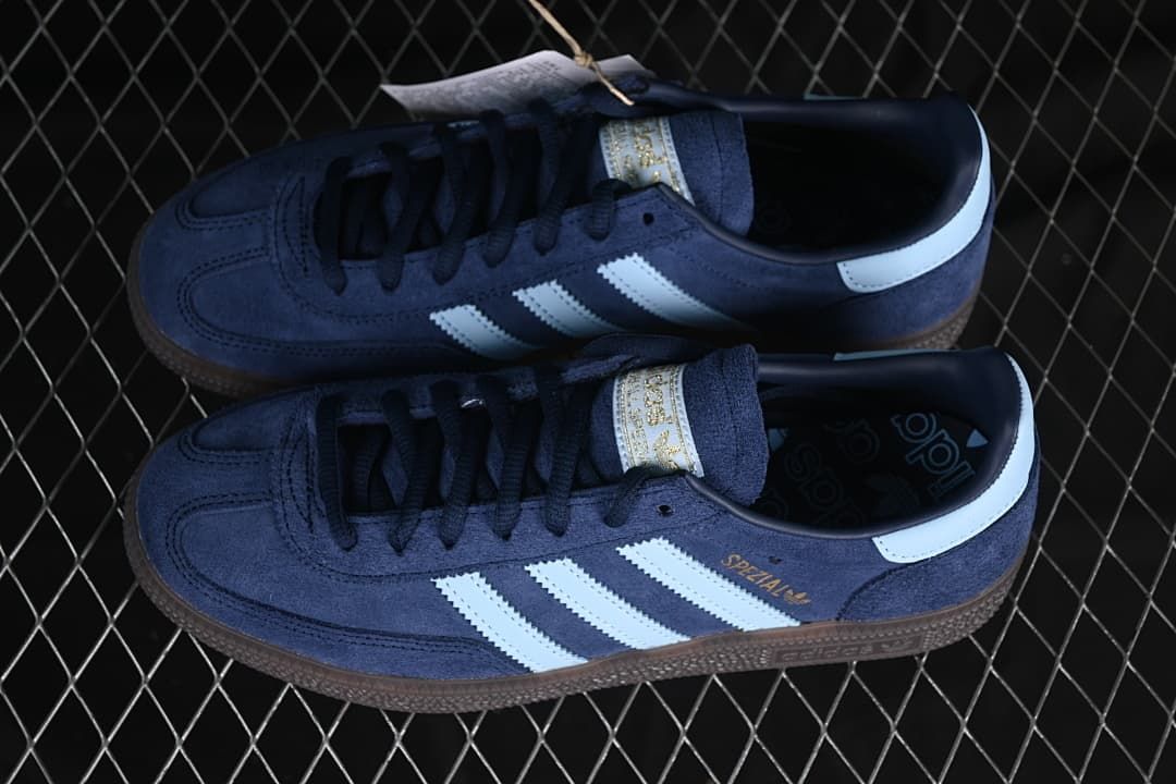 Pair of navy Handball Spezial sneakers with pale blue stripes