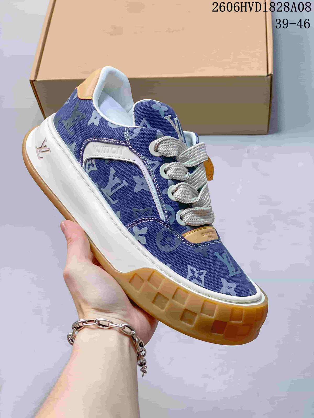 Angled side view of the blue patterned sneaker with white side panel and gum-colored outsole