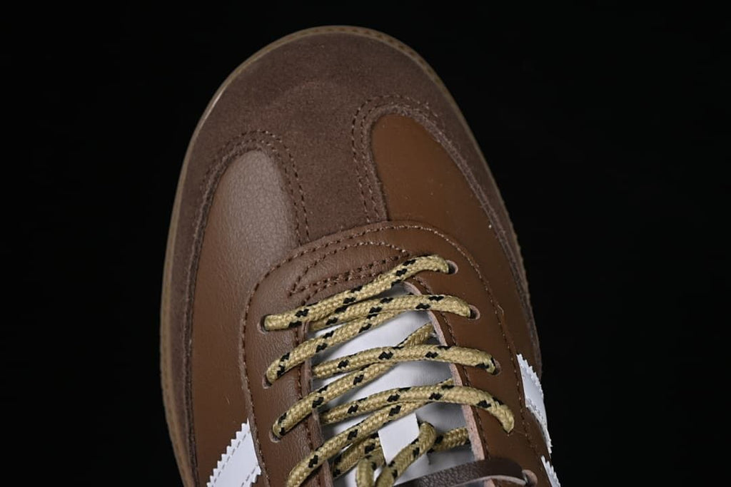 Top-down detail of the brown toe and patterned laces.