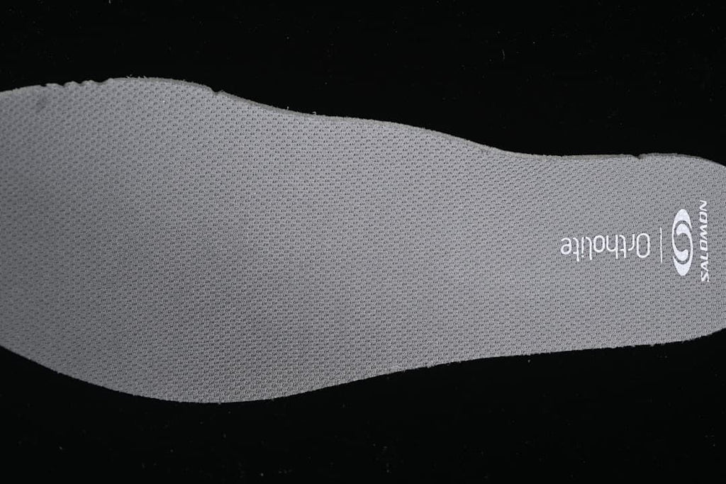 Gray Salomon Ortholite-branded insole shown from above.