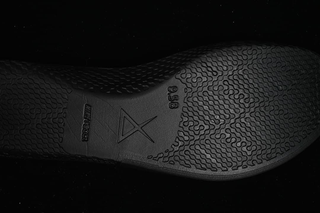 Close-up of patterned black outsole with Kobe branding