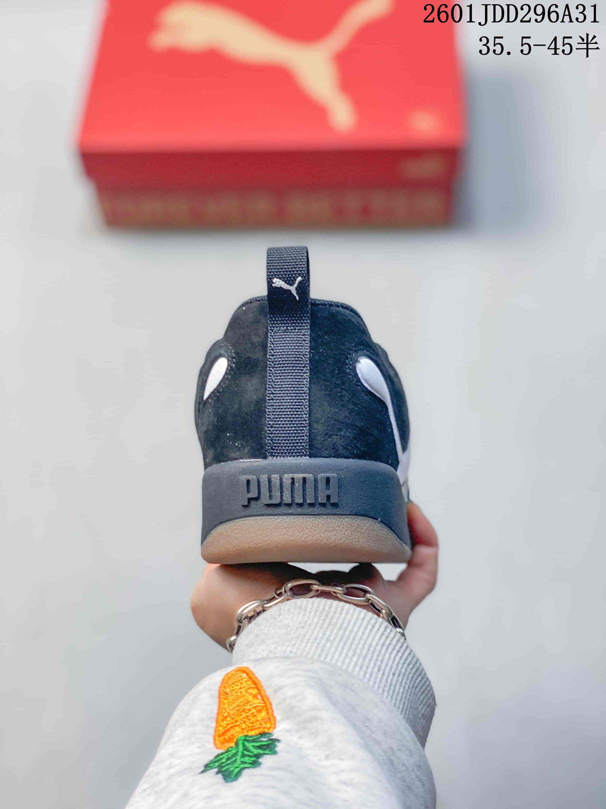 Rear view of a dark sneaker with a branded heel and gum-tone outsole