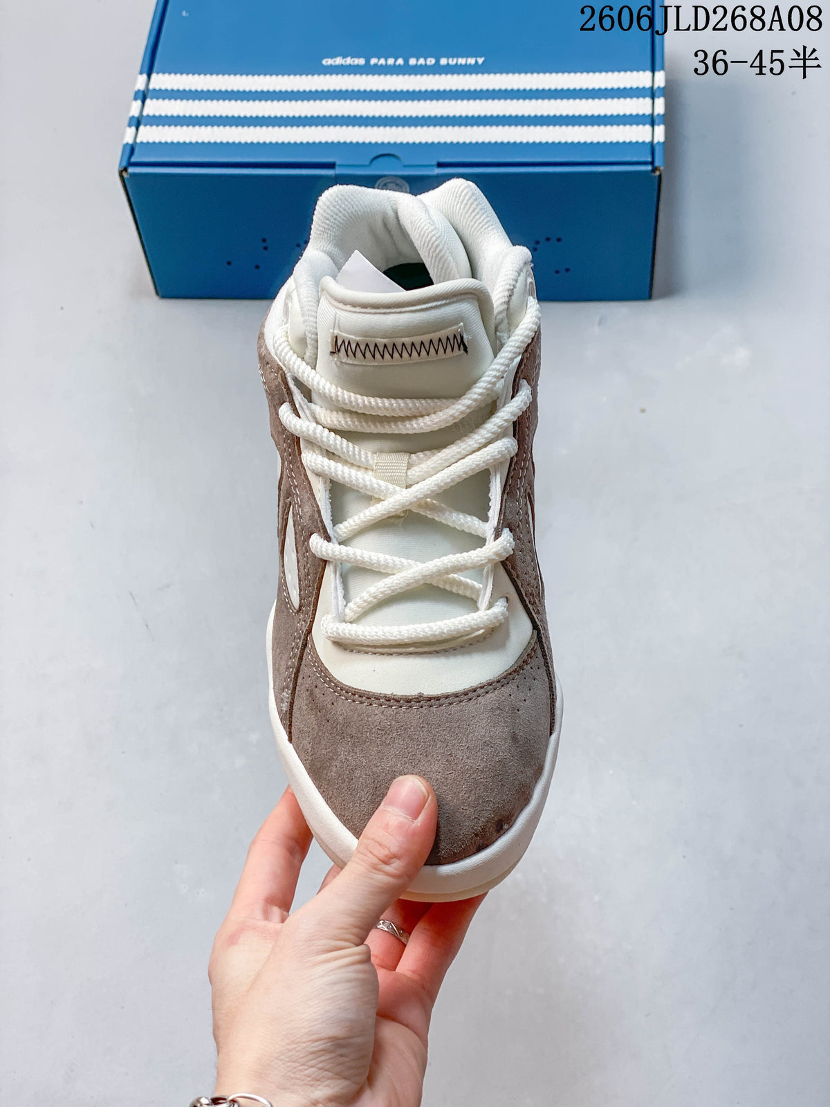 Front view showing the lace-up closure and taupe toe