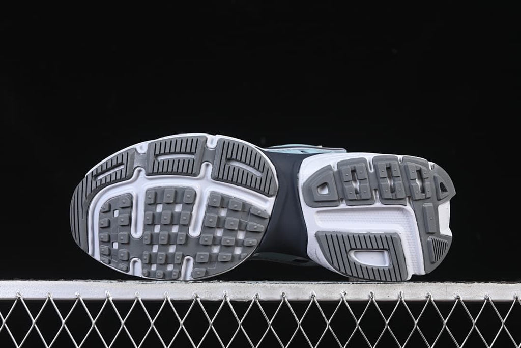 Underside view showing the patterned gray and white outsoles.