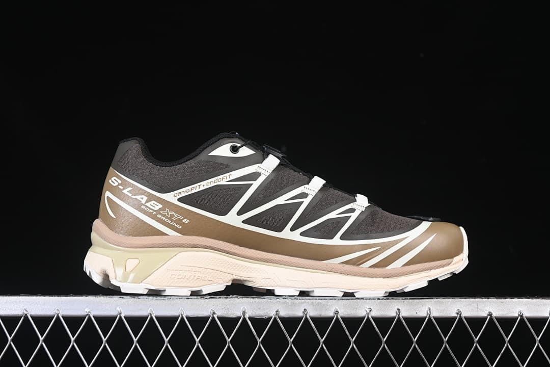 Side profile highlighting the brown and black upper and cream sole.