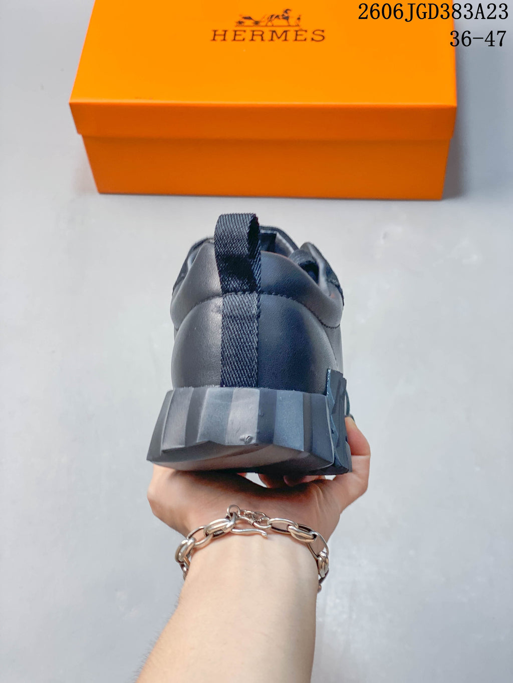 Rear view of the sneaker showing its heel pull tab and sculpted sole.