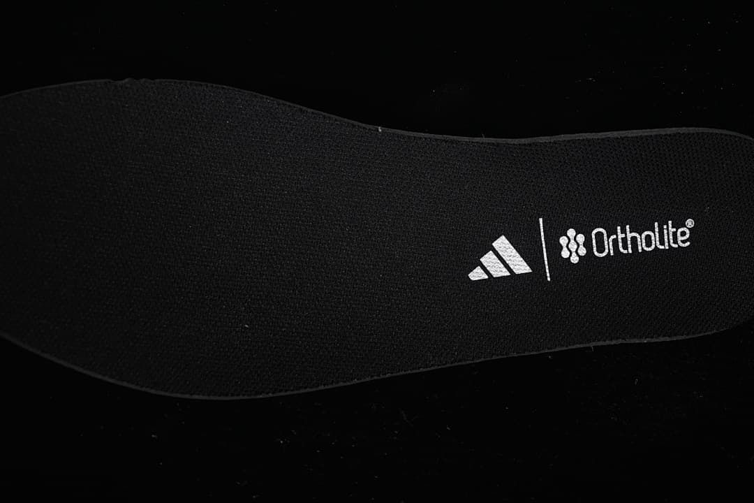 Black insole with Adidas and Ortholite marks