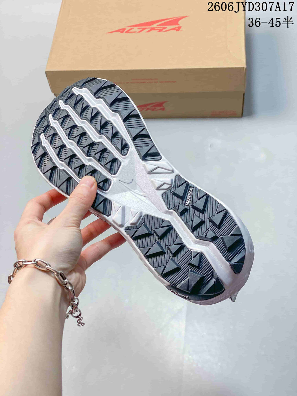Close-up of the patterned outsole on a gray Altra running shoe