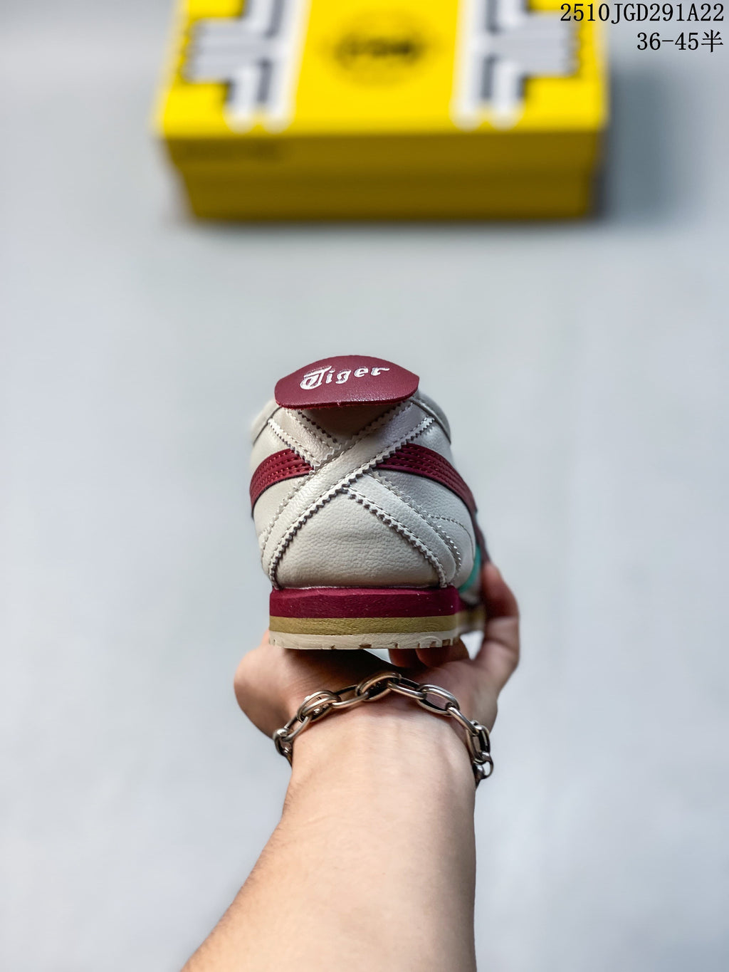 Rear view showing the heel stitching and burgundy details on an off-white sneaker.