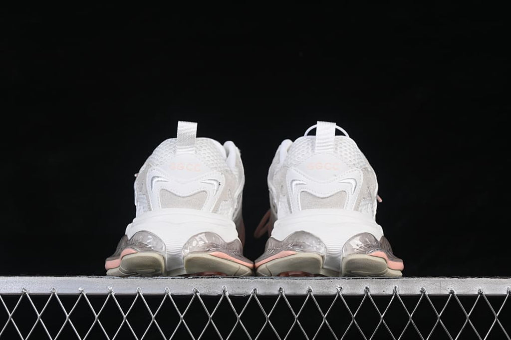 Rear view showing the heel details and sculpted sole of the GG-CC sneakers.