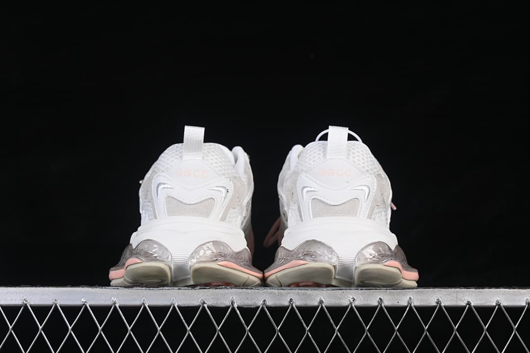Rear view showing the heel details and sculpted sole of the GG-CC sneakers.