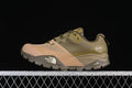 Side view of an olive-green and tan The North Face low-cut hiking shoe