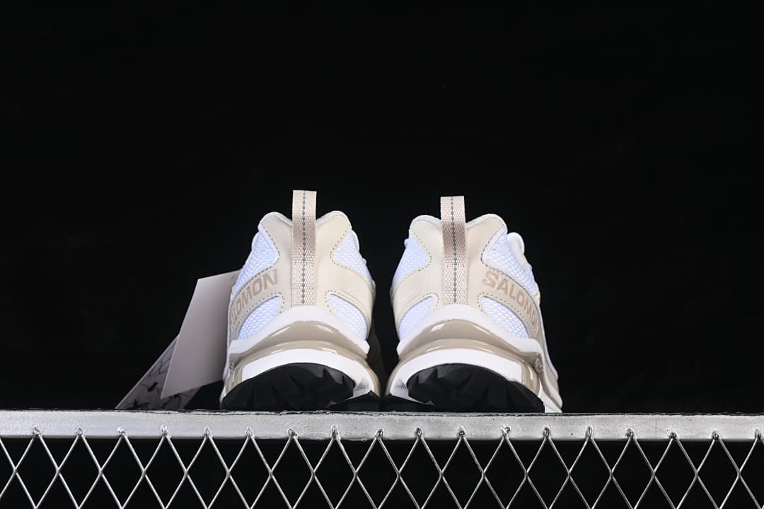 Rear view of the pair showing heel details and outsole tread.