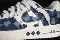Close-up of the blue distressed denim-style upper, rope laces, and ACE side graphics