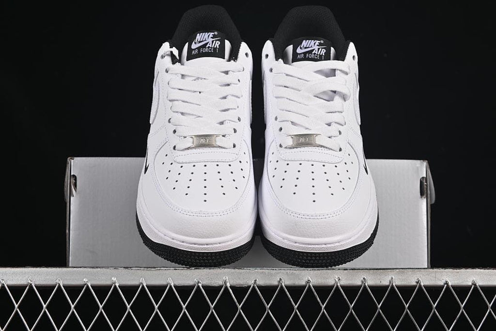 Front view of the pair showing perforated toe boxes and white laces