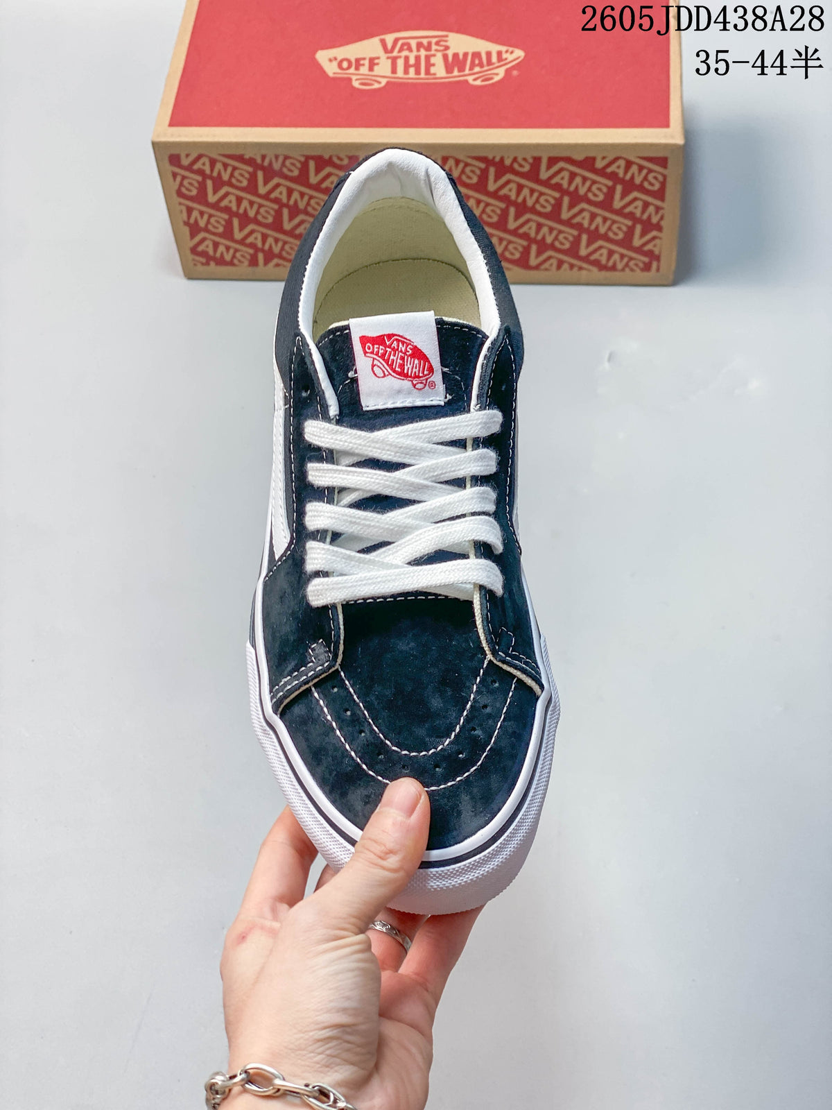 Top view of a dark green Vans Old Skool sneaker with white laces.