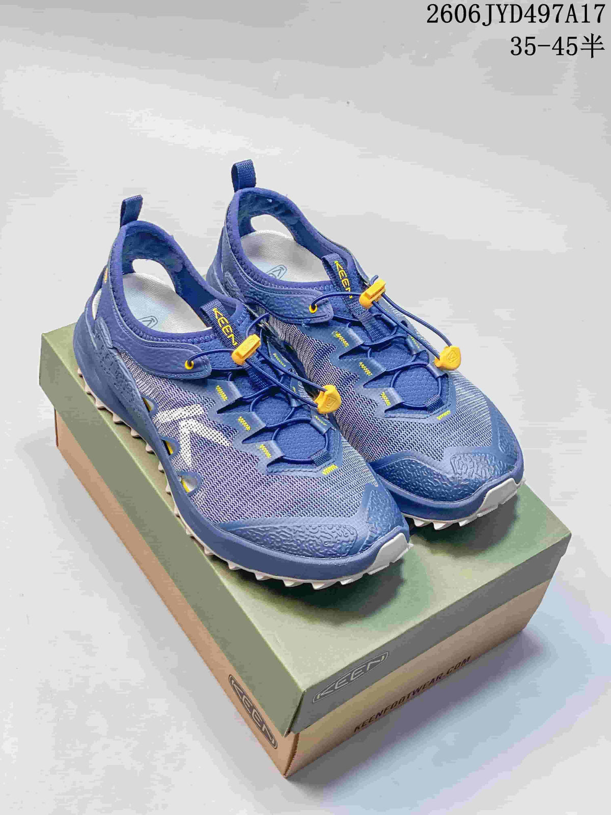Pair of blue KEEN Zionic ADV hiking shoes with yellow drawcord toggles
