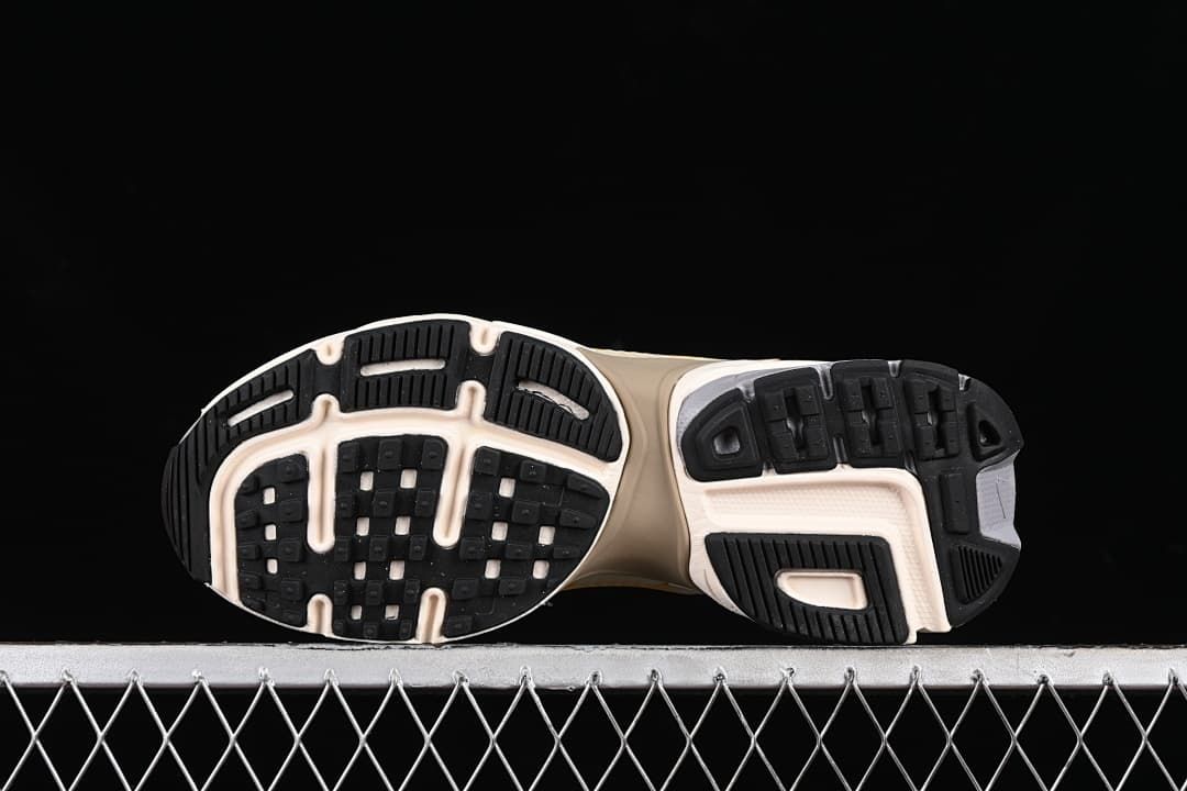 Underside view showing the segmented black rubber outsole.