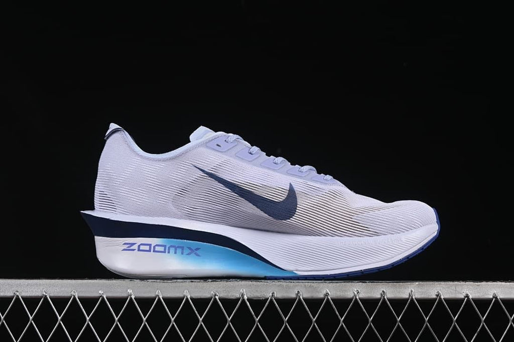 Outer side view of the shoe with dark blue Swoosh and ZoomX branding