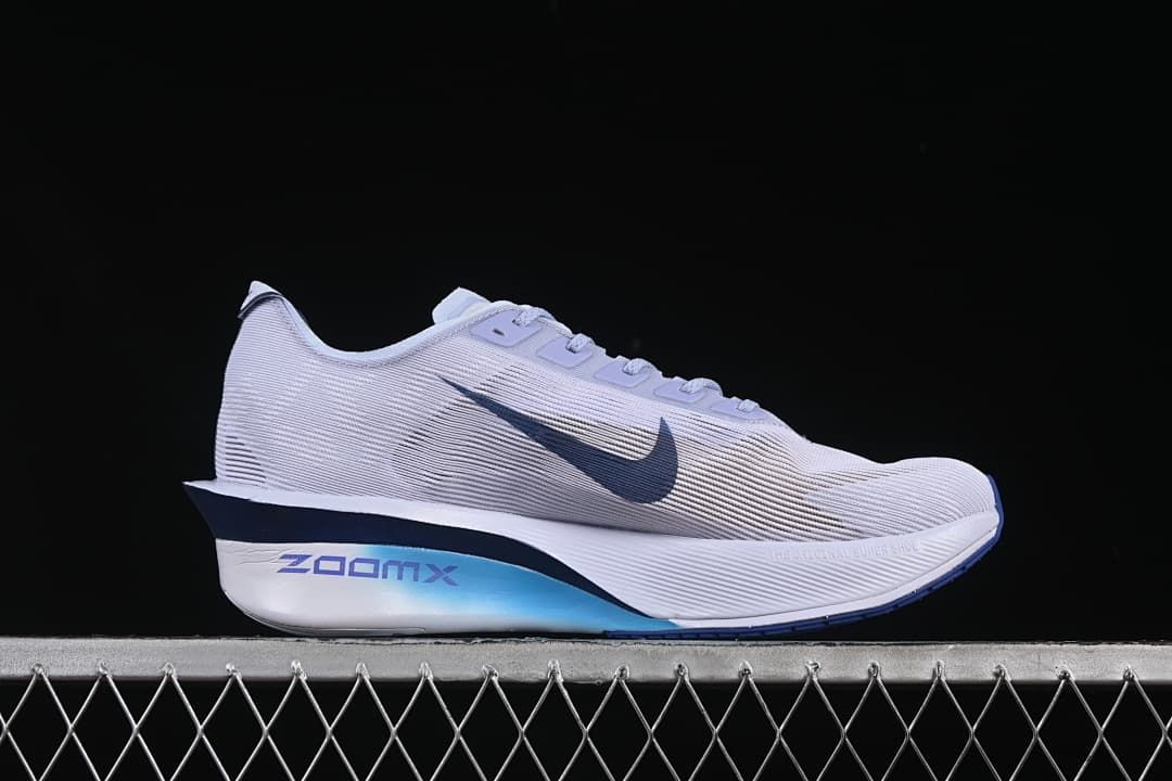 Outer side view of the shoe with dark blue Swoosh and ZoomX branding