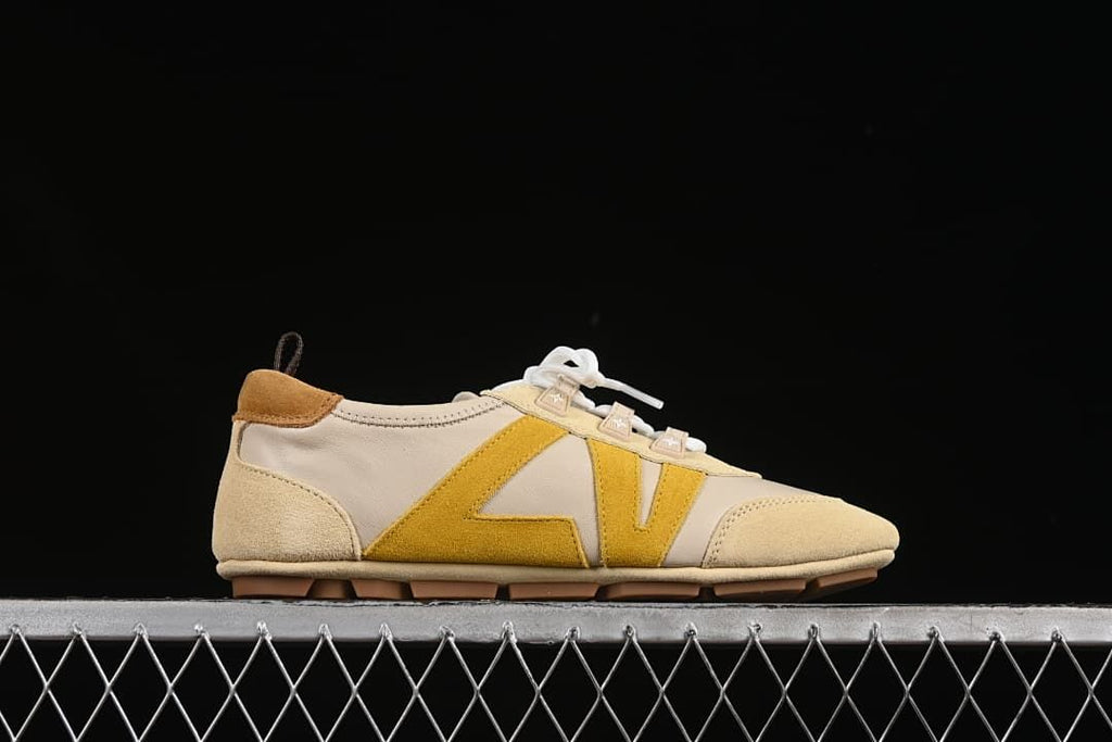 Side profile highlighting the mustard-yellow side detail and low silhouette