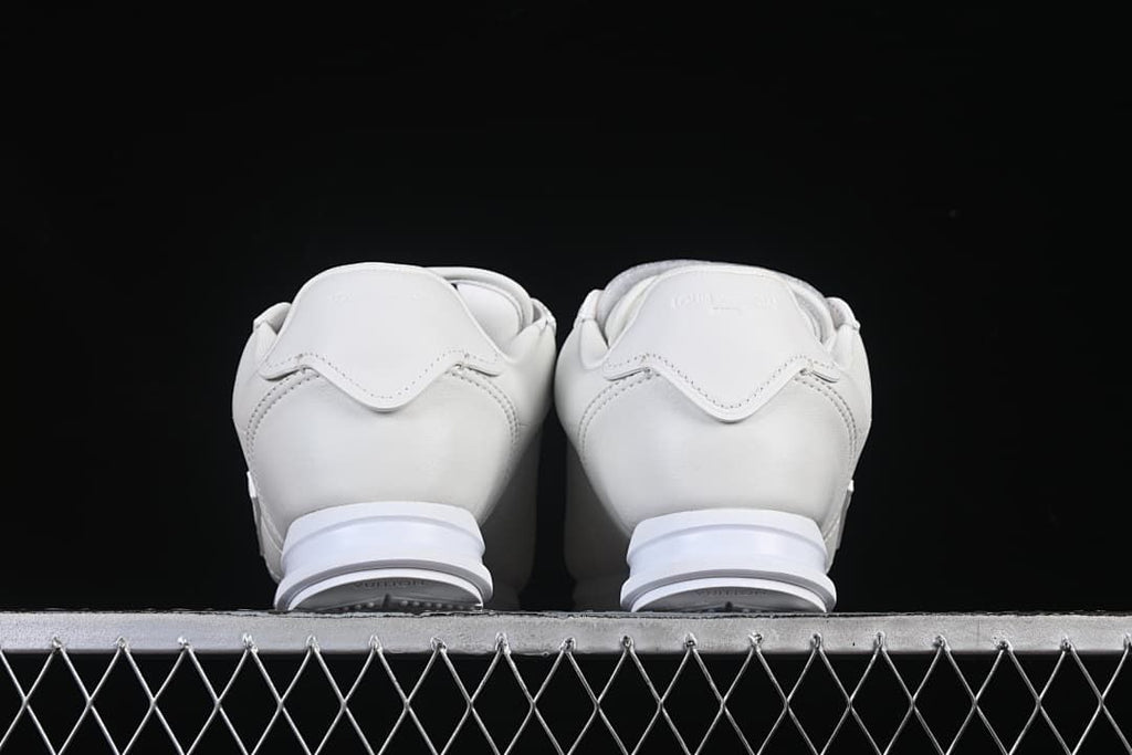 Rear view of the pair showing heel panels and soles