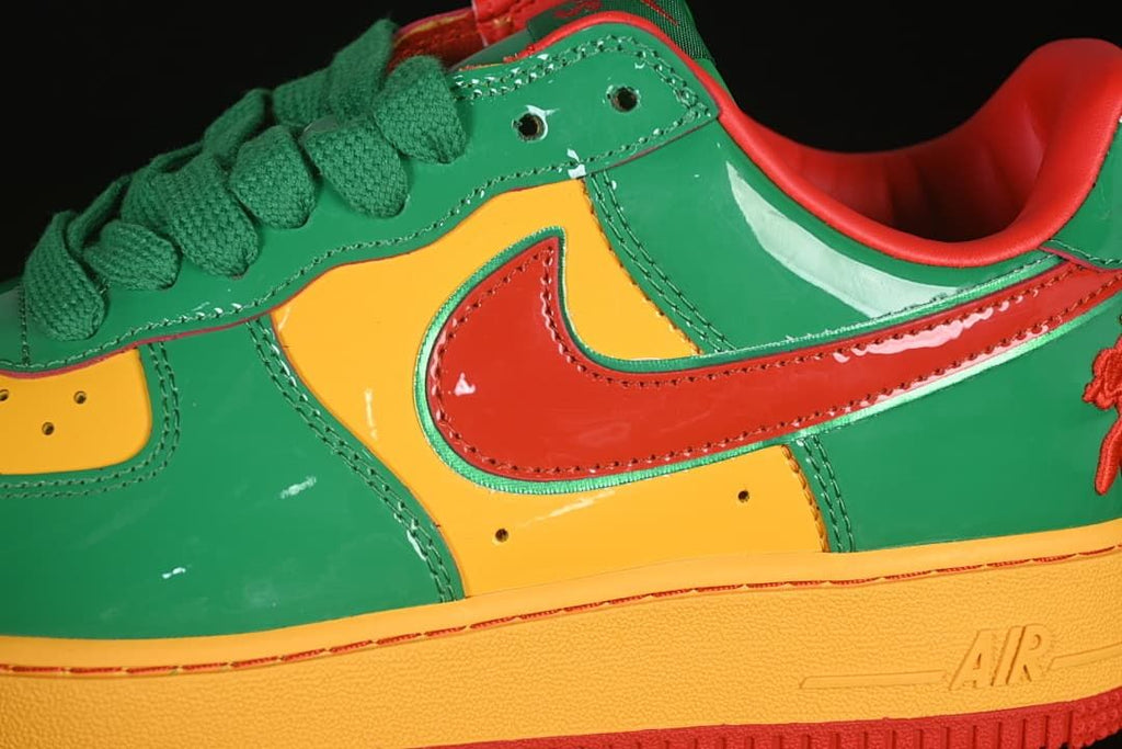 Close-up of the red Swoosh and green and yellow side panels