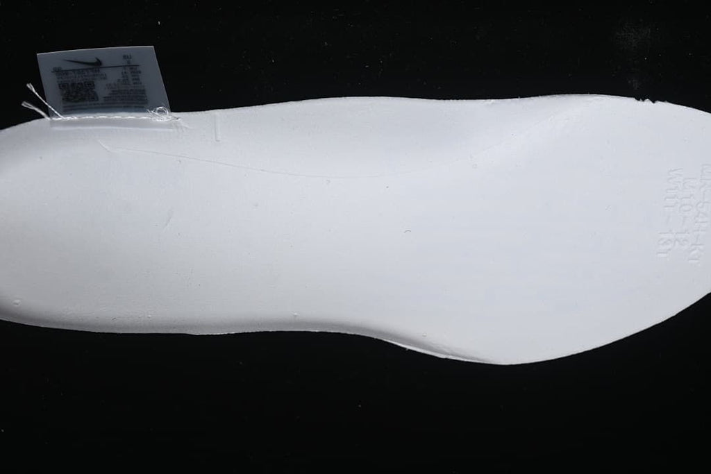 Close-up of the white shoe sole with a small label visible near the edge.