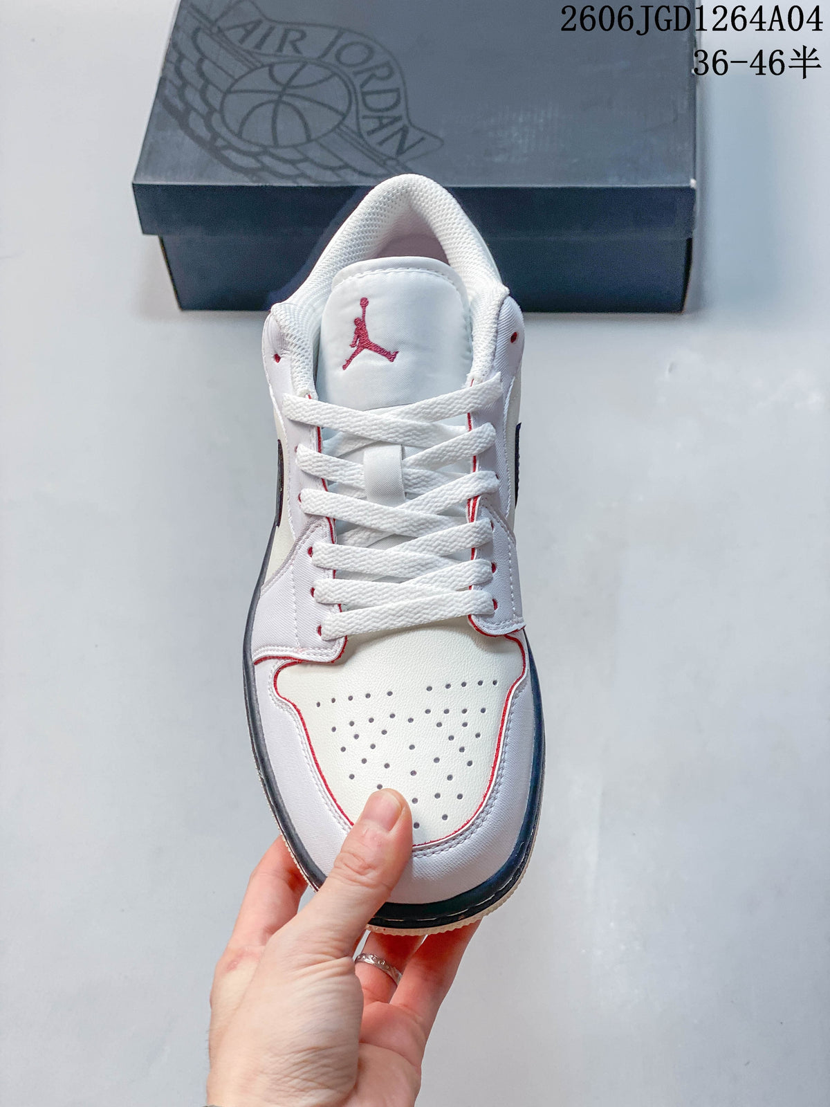 Front view showing perforated toe box, white laces, and red tongue logo