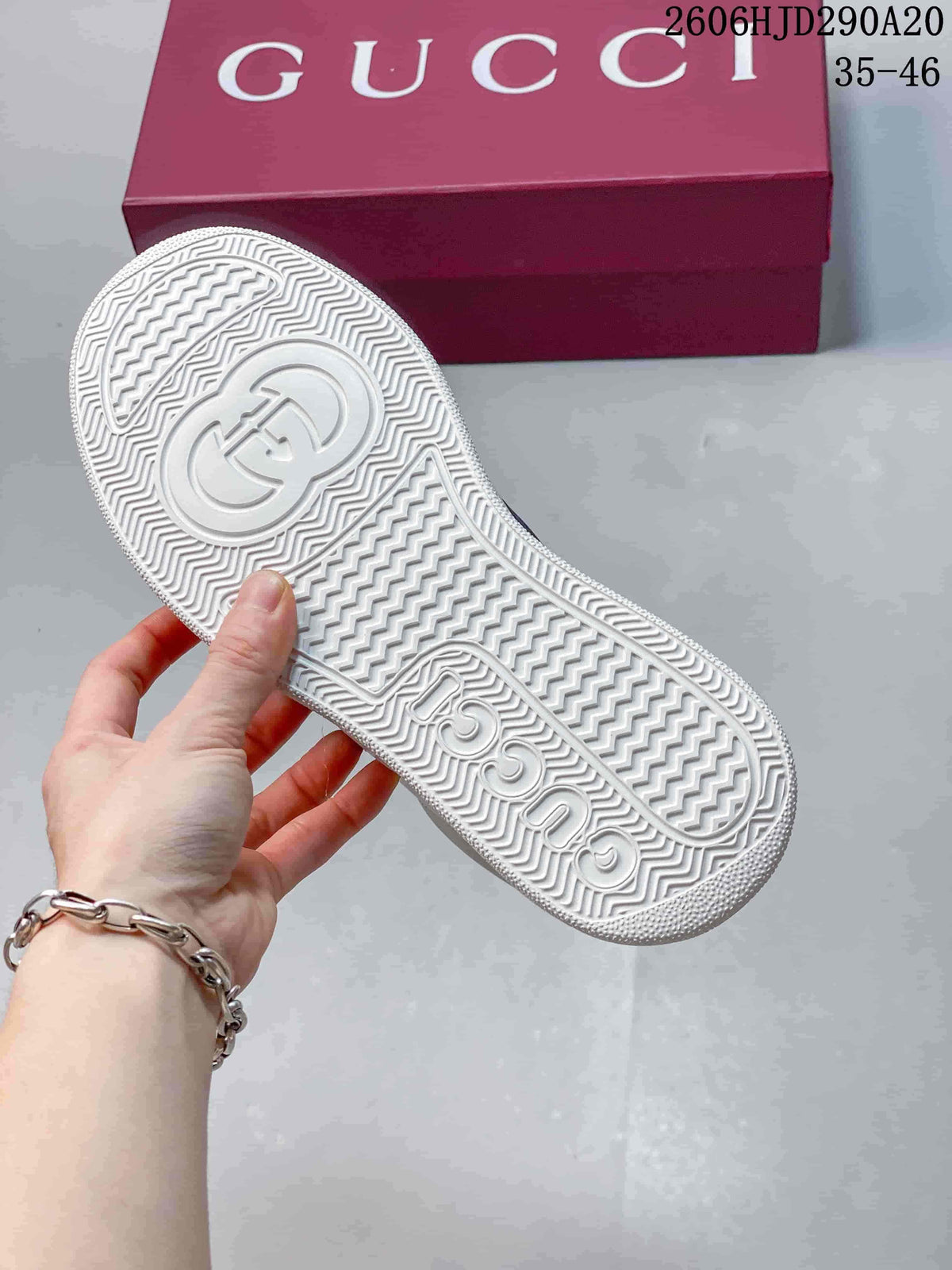 Close-up of the white patterned outsole on a Gucci sneaker