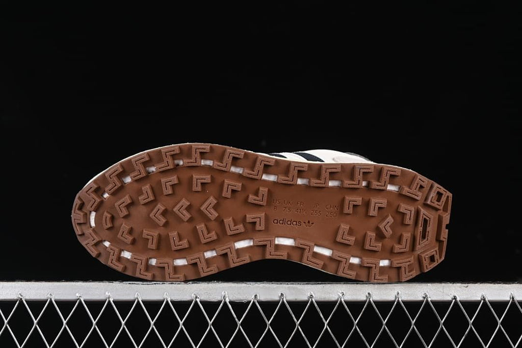 Underside view showing the gum-colored tread and molded size markings.