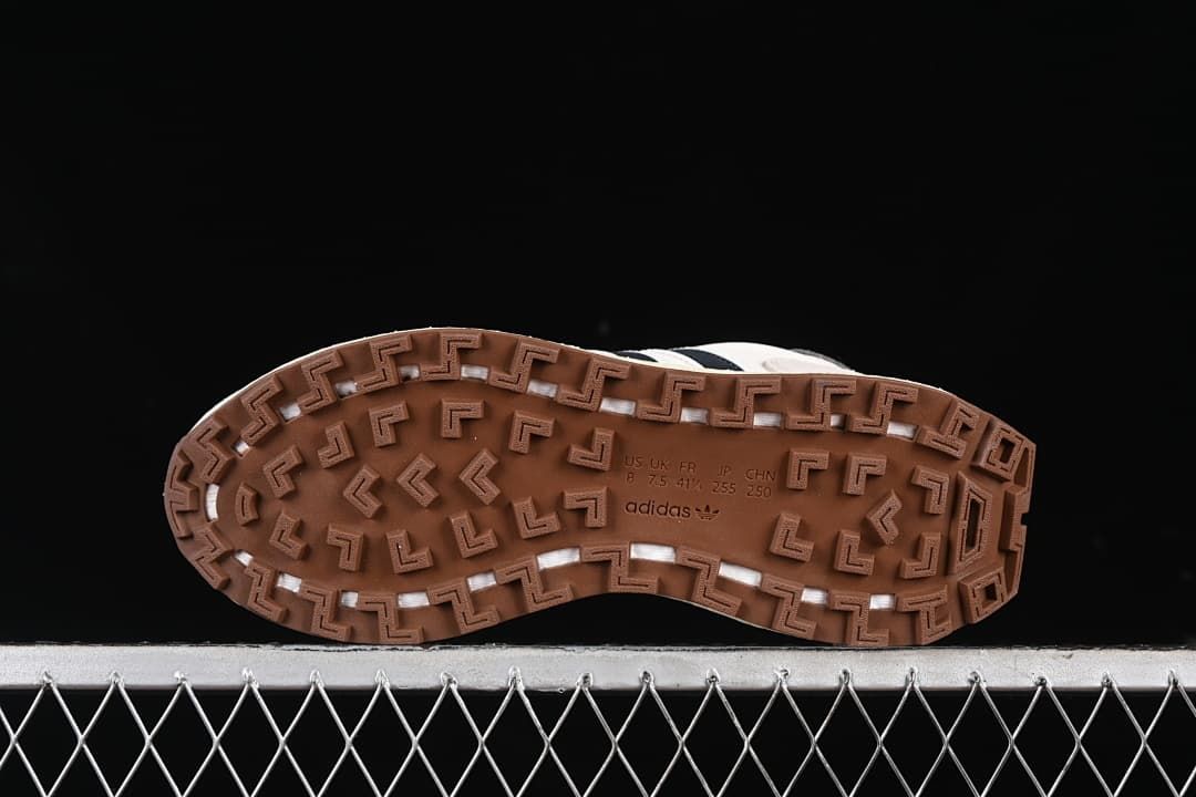Underside view showing the gum-colored tread and molded size markings.