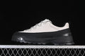 Side view of light grey and black The North Face low-top outdoor shoes