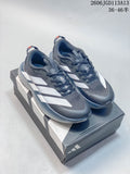Pair of charcoal gray Adidas Adizero Evo SL ATR shoes with white side stripes, shown on a shoebox.