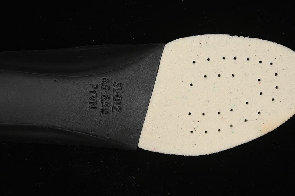 Close-up of the shoe's insole underside with printed size range marking.