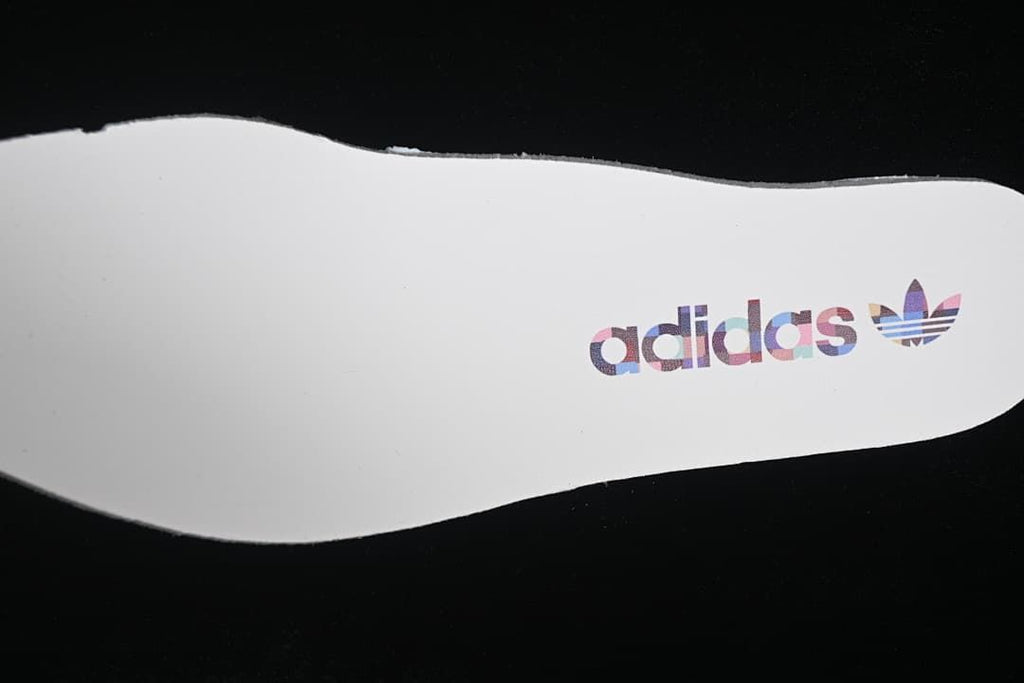 White insole with Adidas Trefoil branding