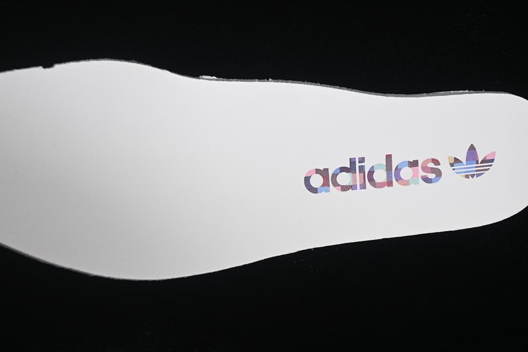 White insole with Adidas Trefoil branding