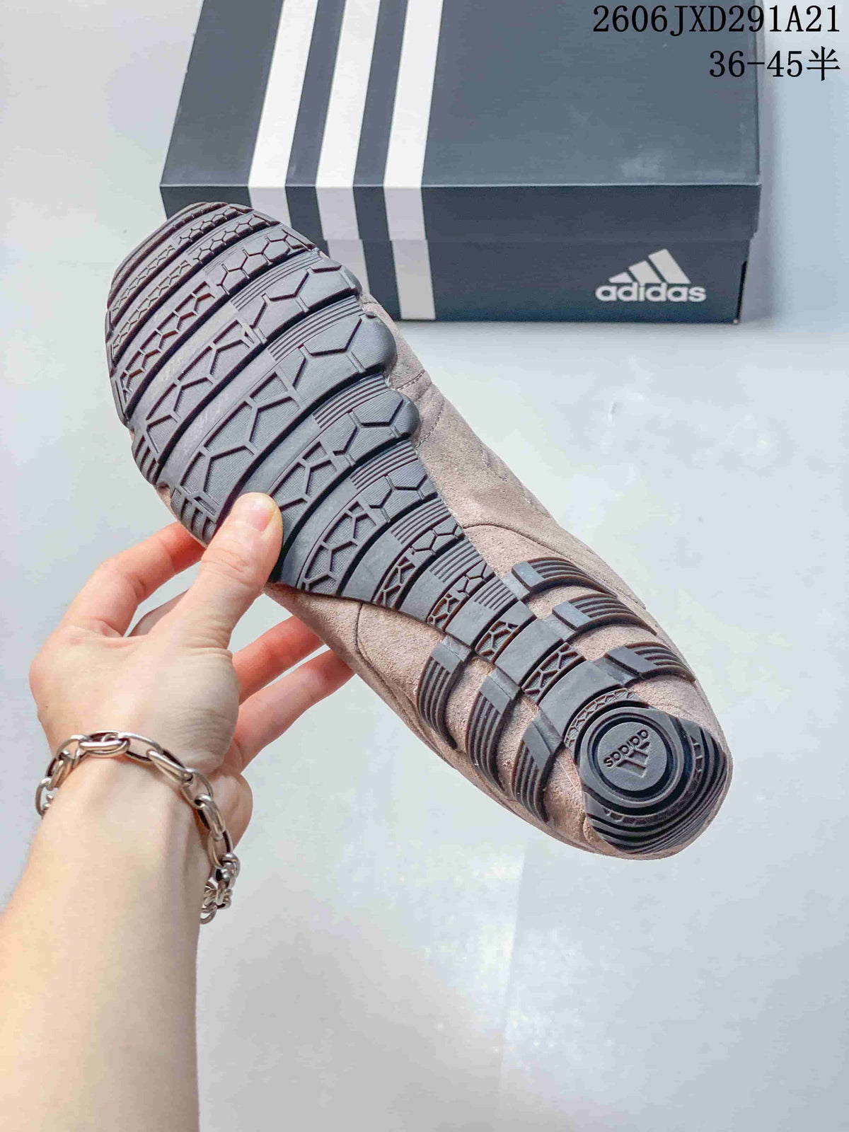 Close-up of the patterned outsole on a taupe Ghost Sprint sneaker