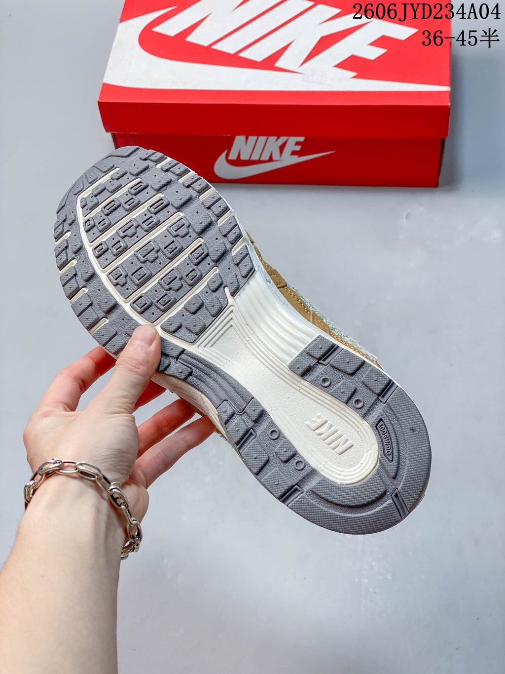 Outsole view of a Nike P-6000 sneaker with a gray patterned tread.