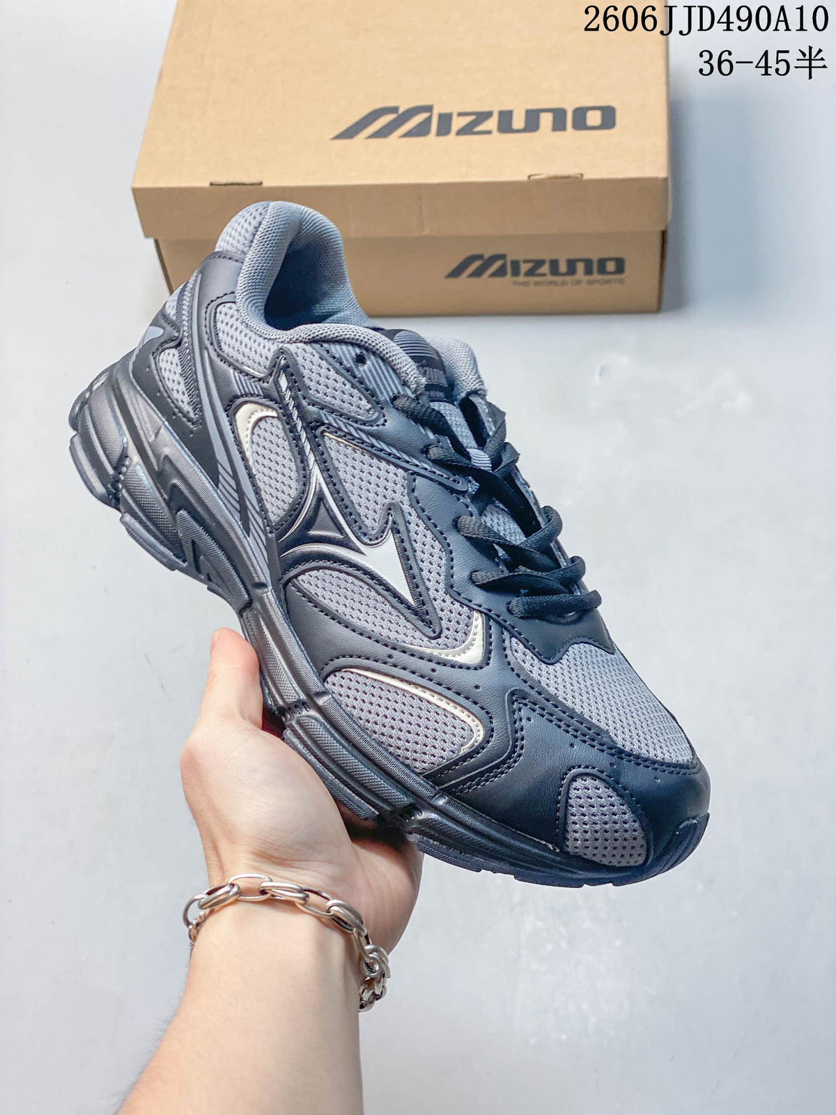 Dark gray and navy mesh Mizuno sneaker with layered overlays.