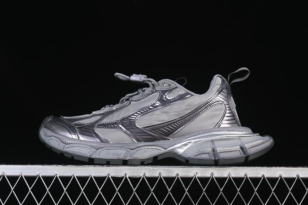 Side view of a grey Balenciaga Phantom sneaker with a chunky sole.