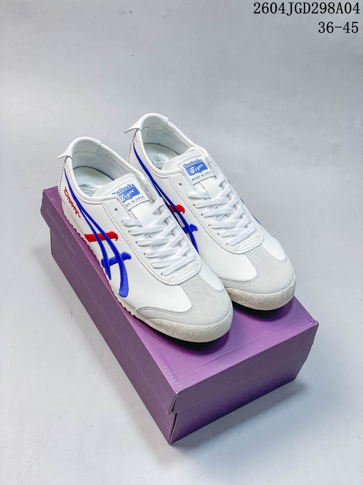 Pair of white Onitsuka Tiger Mexico 66 Deluxe sneakers with blue and red side detailing and gray toe panels