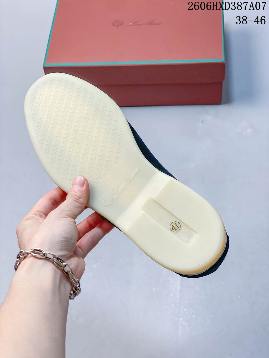 Underside of a loafer showing the sole and a size 41 marking