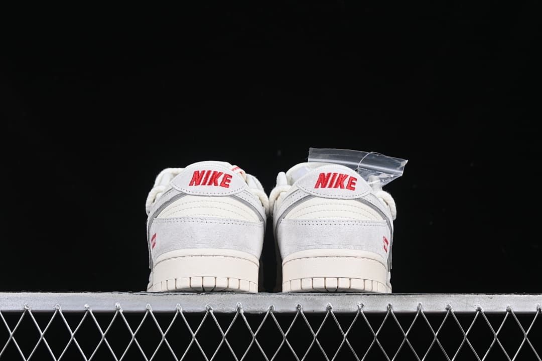 Rear view of both sneakers with red Nike heel logos