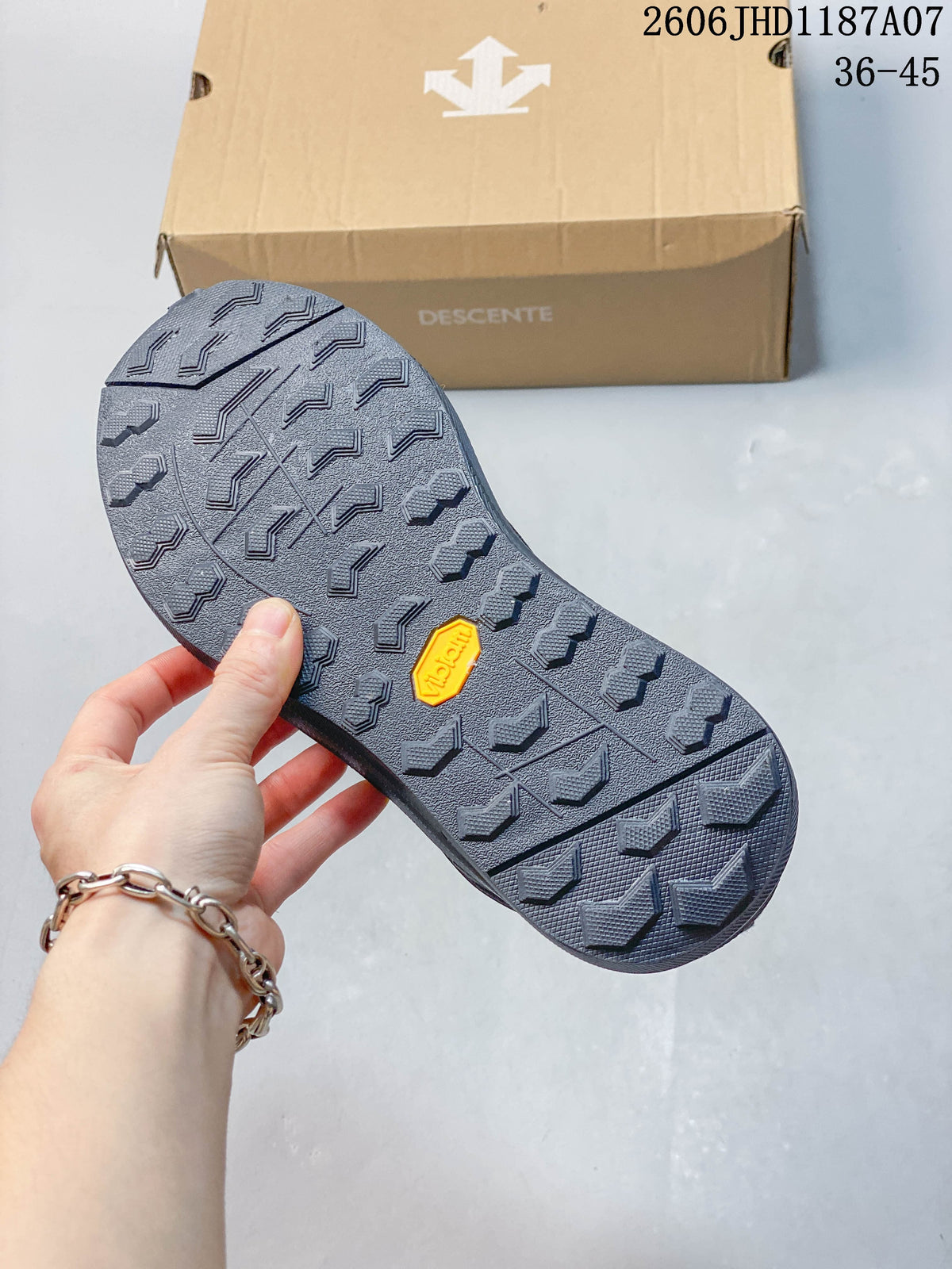 Close-up of the patterned outsole with a yellow Vibram-marked insert
