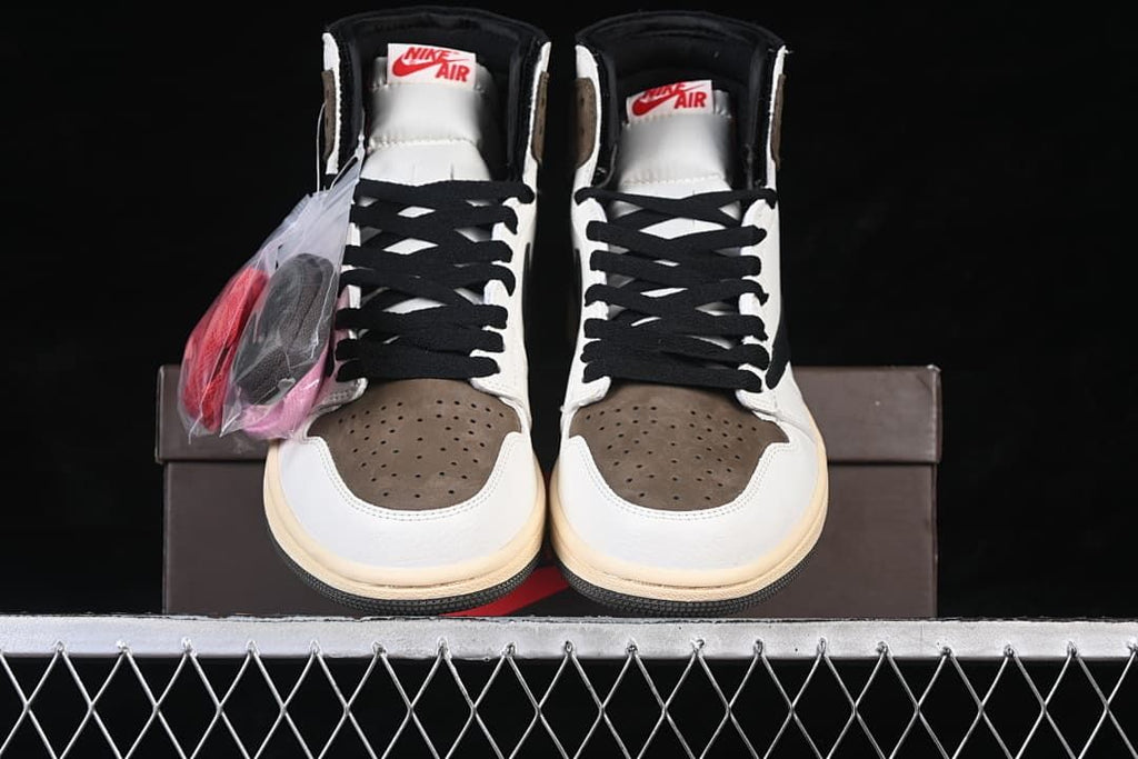 Front view of the high-top sneakers with extra laces in a bag
