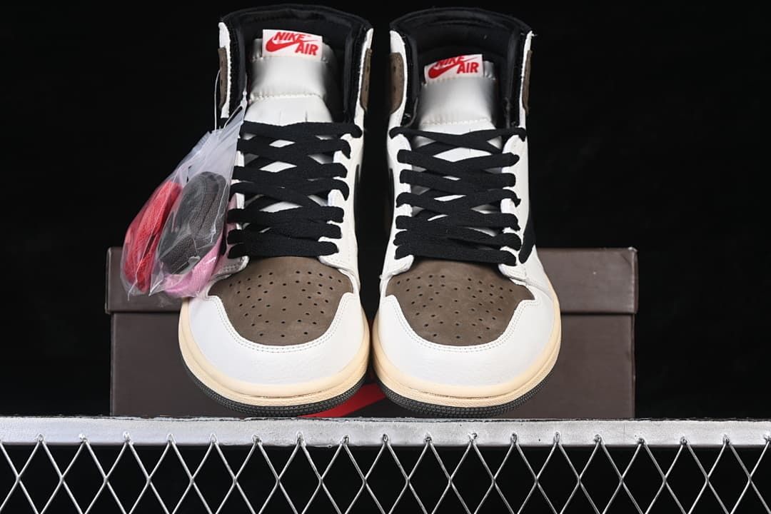 Front view of the high-top sneakers with extra laces in a bag